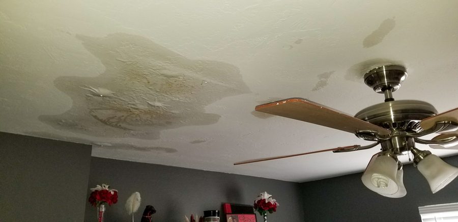 Water-stained ceiling before restoration